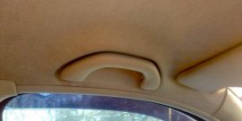 Зачем нужна ручка на потолке автомобиля у места водителя.